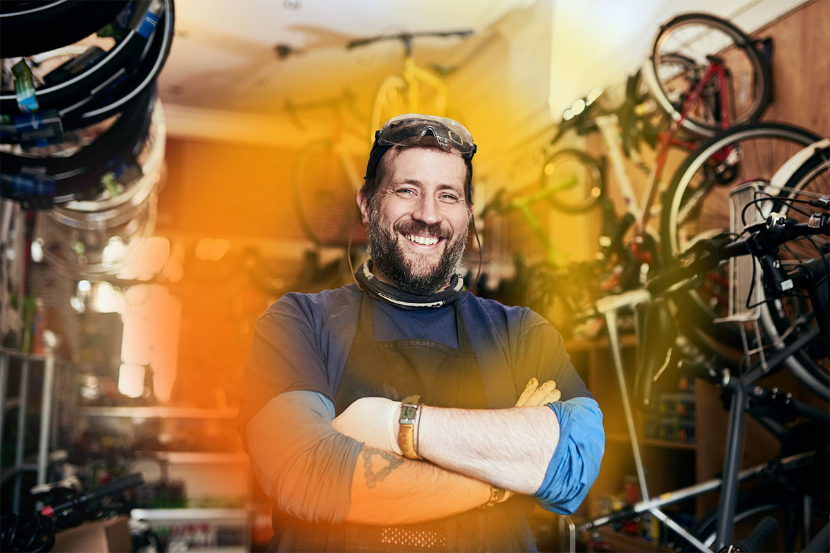 Business owner of bicycle shop, proud to be work, health and safety compliant