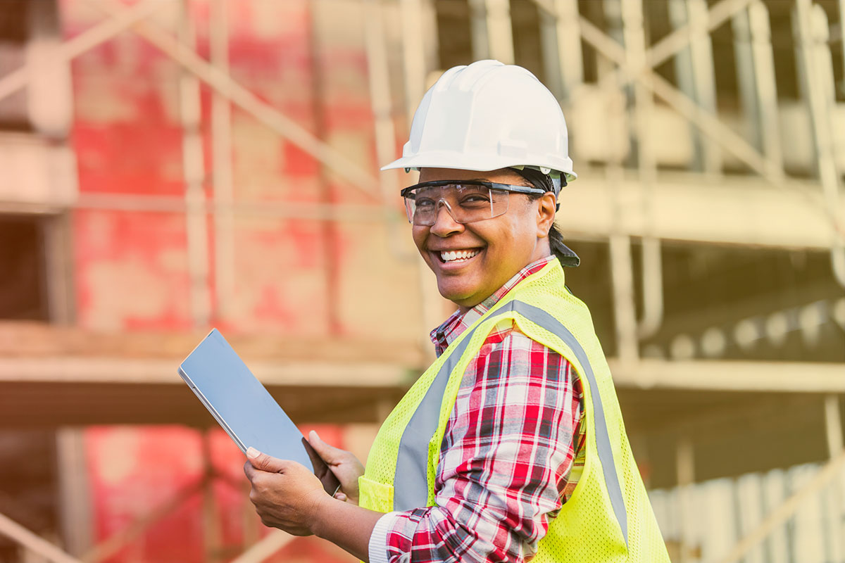 Construction worker enjoying her library of resources on site